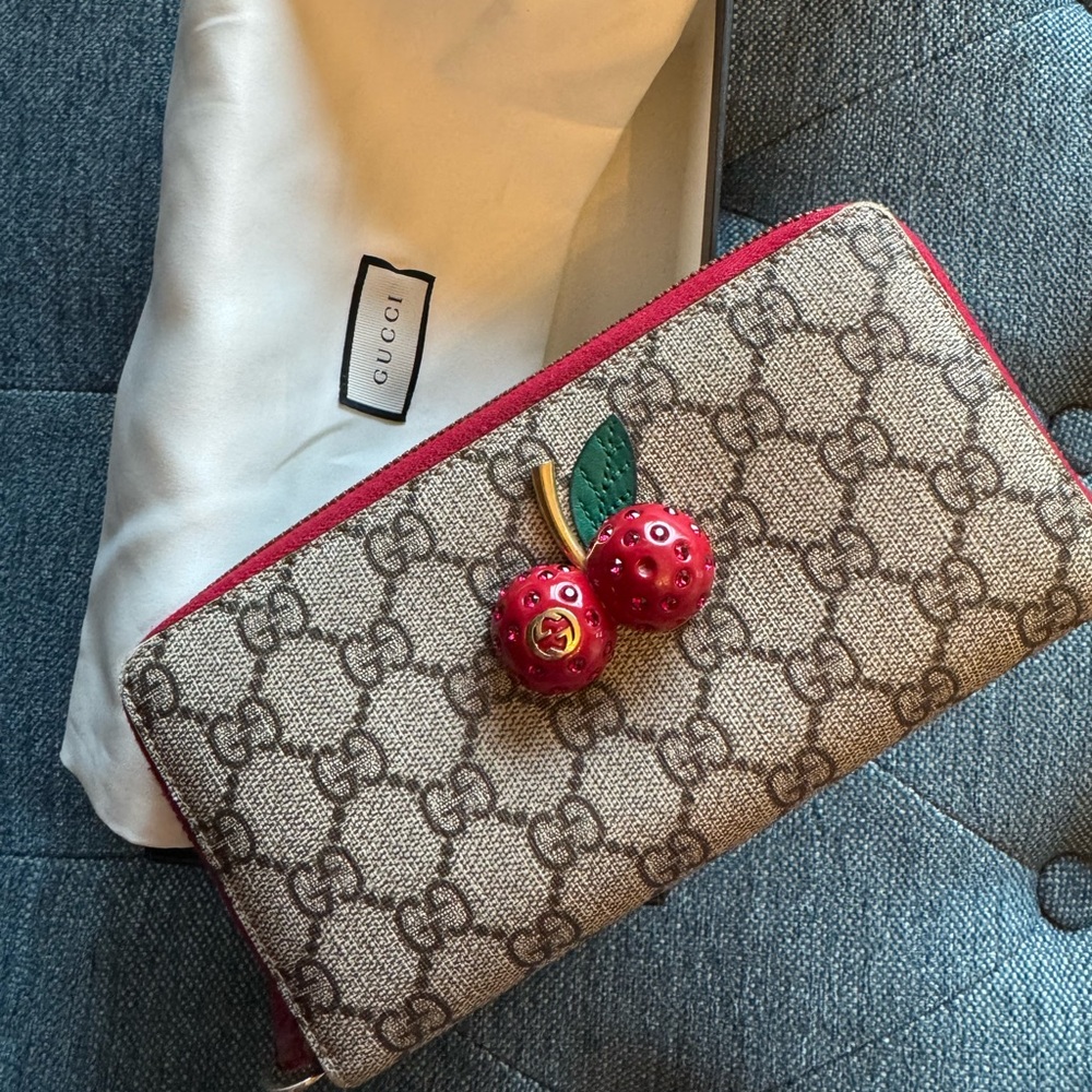 Gucci cherry zip around wallet, good condition with dust bag and box!